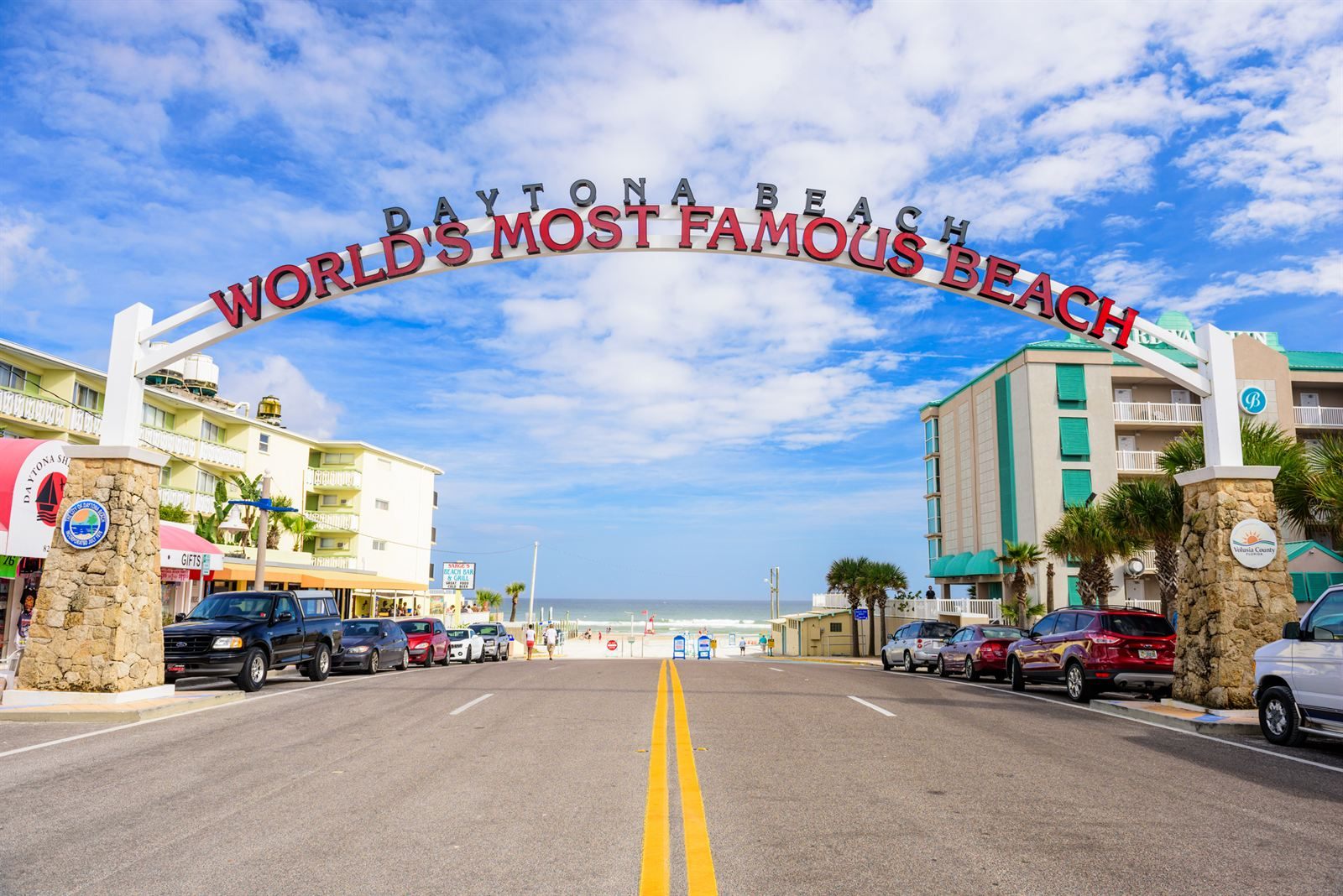 The Daytona Beach arch reading World’s Most Famous Beach over a street that leads to the ocean